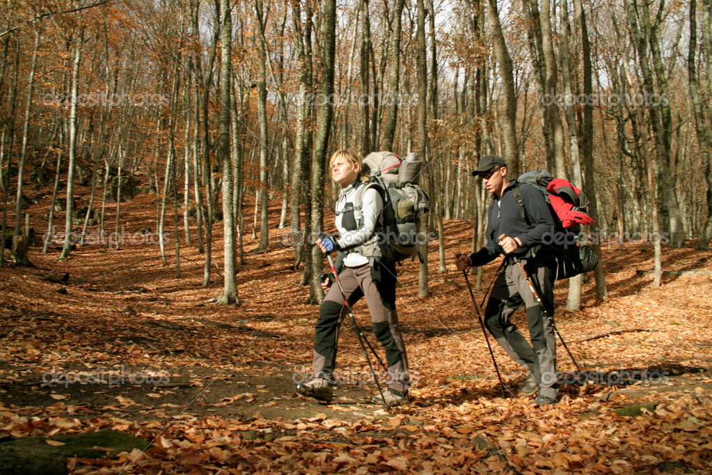 depositphotos_14762611-Young-couple-with-backpacks-in-the-park.-Fall.